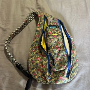 Gray background with rainbow flowers cross backpack